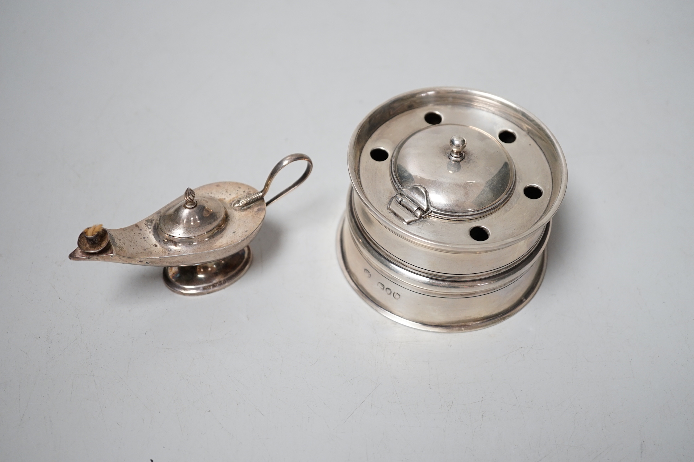 A late Victorina silver inkwell with five pen recesses, William & John Barnard, London 1889, diameter 86mm, and a small George V silver 'Aladdin's lamp' lighter.